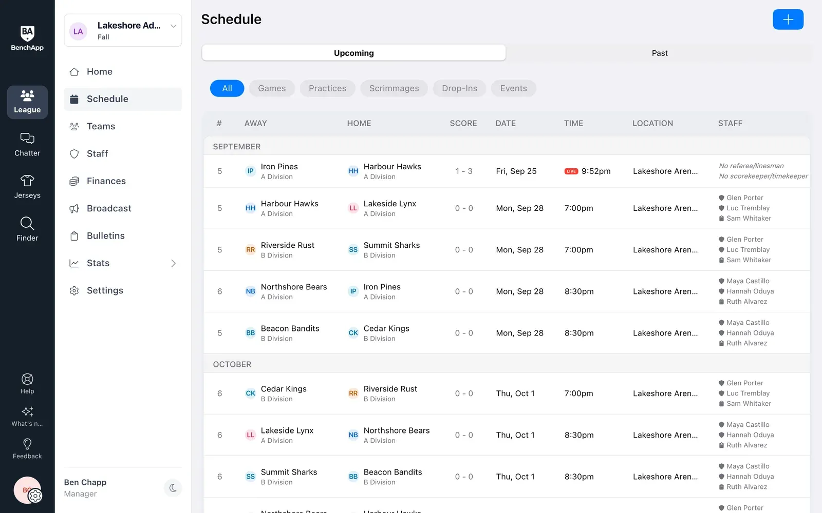 BenchApp on a computer: the league schedule, every division's games by date with assigned officials